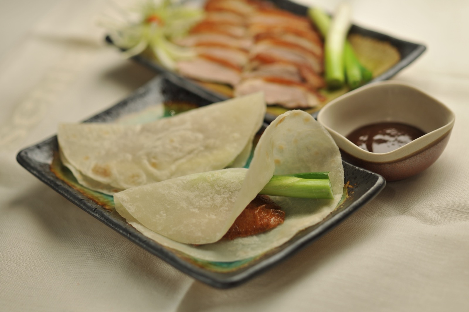 Peking duck pancakes served with hoisin sauce